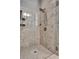 Tiled shower with glass door and rainfall shower head at 6603 Sterling Dr, Atlanta, GA 30328