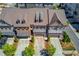 Aerial view of upscale townhomes featuring well-maintained roofs and landscaping in a desirable community at 1005 Milhaven Dr, Roswell, GA 30076