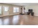 Finished basement with a workout area, an entertainment center, durable flooring, and an exterior door at 1005 Milhaven Dr, Roswell, GA 30076