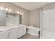Bright bathroom with a double vanity, soaking tub, stand-alone shower, and modern fixtures at 1005 Milhaven Dr, Roswell, GA 30076