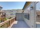 Relaxing deck with a wooden railing, featuring a sidelight by the door at 1005 Milhaven Dr, Roswell, GA 30076