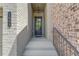 Inviting entryway featuring brick facade, elegant door, and stylish address number for a touch of curb appeal at 1005 Milhaven Dr, Roswell, GA 30076