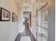 Bright and airy hallway with hardwood floors, elegant lighting, and tasteful decor, creating a welcoming entrance at 1005 Milhaven Dr, Roswell, GA 30076