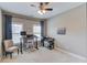 Comfortable home office featuring a desk, office chair, natural light, and light-colored walls at 1005 Milhaven Dr, Roswell, GA 30076