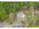 Expansive aerial view of a home with a private pool nestled among mature trees at 1484 W Prospect Dr, Lawrenceville, GA 30043