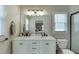 Well lit bathroom features double sinks, natural light, and modern fixtures at 1484 W Prospect Dr, Lawrenceville, GA 30043