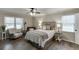 Comfortable bedroom with natural light, ceiling fan, and stylish decor and flooring at 1484 W Prospect Dr, Lawrenceville, GA 30043
