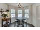 This eat-in dining area with shiplap walls has views of the backyard pool at 1484 W Prospect Dr, Lawrenceville, GA 30043