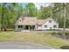 Charming home with a welcoming front porch and a well-manicured lawn at 1484 W Prospect Dr, Lawrenceville, GA 30043