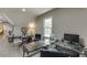 Bright home office setup with sleek black desk and chairs, natural light, and hardwood flooring at 1484 W Prospect Dr, Lawrenceville, GA 30043