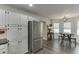 Bright kitchen features stainless steel appliances, modern lighting, and a cozy breakfast nook area at 1484 W Prospect Dr, Lawrenceville, GA 30043