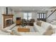Cozy living room showcasing a fireplace, hardwood floors, and comfortable seating, perfect for gatherings at 1484 W Prospect Dr, Lawrenceville, GA 30043