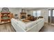 Charming living room with a brick fireplace, wood floors, and a cozy white sofa at 1484 W Prospect Dr, Lawrenceville, GA 30043