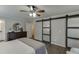 Lovely main bedroom features a large closet, natural light, and hardwood flooring at 1484 W Prospect Dr, Lawrenceville, GA 30043