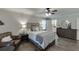 Comfortable main bedroom features natural light, stylish decor, and hardwood flooring at 1484 W Prospect Dr, Lawrenceville, GA 30043