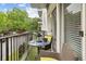 Cozy balcony with a bistro set overlooks lush green trees at 3201 Lenox Ne Rd # 22, Atlanta, GA 30324