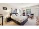 Bright bedroom features neutral decor, zebra art, and French doors to balcony at 3201 Lenox Ne Rd # 22, Atlanta, GA 30324