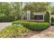 Well-manicured landscape featuring community signage for 'The St. James', complemented by lush greenery at 3201 Lenox Ne Rd # 22, Atlanta, GA 30324