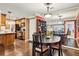 Dining area near the kitchen with hardwood floors and views of the connected living spaces at 3201 Lenox Ne Rd # 22, Atlanta, GA 30324