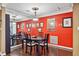 Inviting dining room with a dark wood table, seating for four, and an accent wall at 3201 Lenox Ne Rd # 22, Atlanta, GA 30324