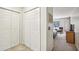 Hallway with closet doors leading into a bedroom featuring French doors and a balcony at 3201 Lenox Ne Rd # 22, Atlanta, GA 30324