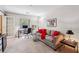Cozy living room features a sofa, a desk, and French doors to balcony at 3201 Lenox Ne Rd # 22, Atlanta, GA 30324