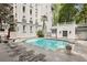 Relax by the community's refreshing outdoor swimming pool and adjacent lounge area at 3201 Lenox Ne Rd # 22, Atlanta, GA 30324