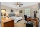 Cozy bedroom featuring a ceiling fan, neutral decor, and comfortable furnishings at 480 Springs End Ne Ln, Marietta, GA 30068