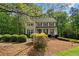 Charming two-story home with well-maintained lawn and mature trees, offering a serene and inviting curb appeal at 480 Springs End Ne Ln, Marietta, GA 30068