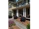 Charming two-story home with a welcoming front porch and manicured landscaping at 480 Springs End Ne Ln, Marietta, GA 30068