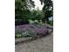 Beautiful front yard with a colorful flower bed and well-maintained landscaping at 480 Springs End Ne Ln, Marietta, GA 30068