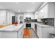 Open kitchen with white cabinets, stainless steel appliances, and a large center island at 480 Springs End Ne Ln, Marietta, GA 30068