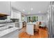 Modern kitchen with granite countertops, stainless steel appliances, and a center island, perfect for cooking and dining at 480 Springs End Ne Ln, Marietta, GA 30068