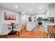 Open kitchen and dining area with white cabinets and stainless steel appliances at 480 Springs End Ne Ln, Marietta, GA 30068