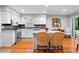 Charming kitchen featuring white cabinets, stainless appliances, and a center island with seating at 480 Springs End Ne Ln, Marietta, GA 30068