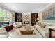 Bright living room featuring a brick fireplace and comfortable white couches at 480 Springs End Ne Ln, Marietta, GA 30068