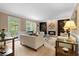 Inviting living room featuring a brick fireplace, built-in shelves, and a comfortable seating area at 480 Springs End Ne Ln, Marietta, GA 30068
