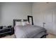 This cozy bedroom features a large bed, tall ceilings, and stylish decor elements at 5883 Brookside Oak Cir, Norcross, GA 30093