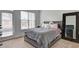 This cozy bedroom features a large window, comfortable bed, and stylish decor elements at 5883 Brookside Oak Cir, Norcross, GA 30093