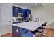 Kitchen with navy cabinets, stainless steel appliances, a marble countertop island, and bar seating at 5883 Brookside Oak Cir, Norcross, GA 30093