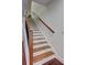 This staircase features hardwood stairs, and hardwood railings at 5883 Brookside Oak Cir, Norcross, GA 30093