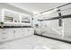 Modern bathroom featuring double vanity, large walk-in shower with a glass enclosure and luxurious soaking tub at 662 S Grand Nw Ave, Atlanta, GA 30318