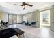 Bright bedroom with ceiling fan, balcony access and decorative wall design at 662 S Grand Nw Ave, Atlanta, GA 30318
