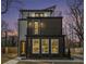 Striking modern three-story home featuring two balconies and excellent exterior lighting at 662 S Grand Nw Ave, Atlanta, GA 30318