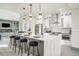Open-concept kitchen with large island, stainless steel appliances, and modern finishes at 662 S Grand Nw Ave, Atlanta, GA 30318