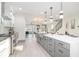 Bright, open kitchen with stainless steel appliances, white cabinets, and a large island at 662 S Grand Nw Ave, Atlanta, GA 30318