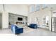 Bright living room boasts large windows, built-in shelving, and modern fireplace at 662 S Grand Nw Ave, Atlanta, GA 30318