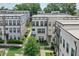 Aerial view of townhomes with manicured landscaping and sidewalks throughout the community at 2032 Holtz Ln, Atlanta, GA 30318
