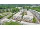 Rows of newly built townhomes featuring private balconies in a community with mature trees at 2032 Holtz Ln, Atlanta, GA 30318