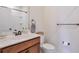 Bathroom featuring a wood vanity, white sink, and chrome fixtures at 2032 Holtz Ln, Atlanta, GA 30318